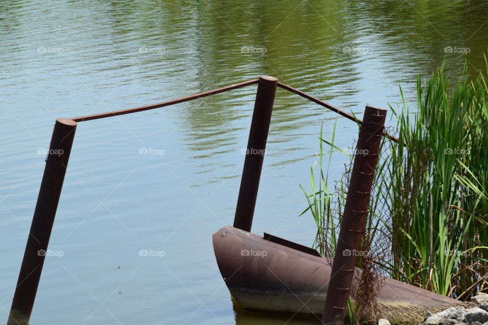 A boat sunk in a lake 