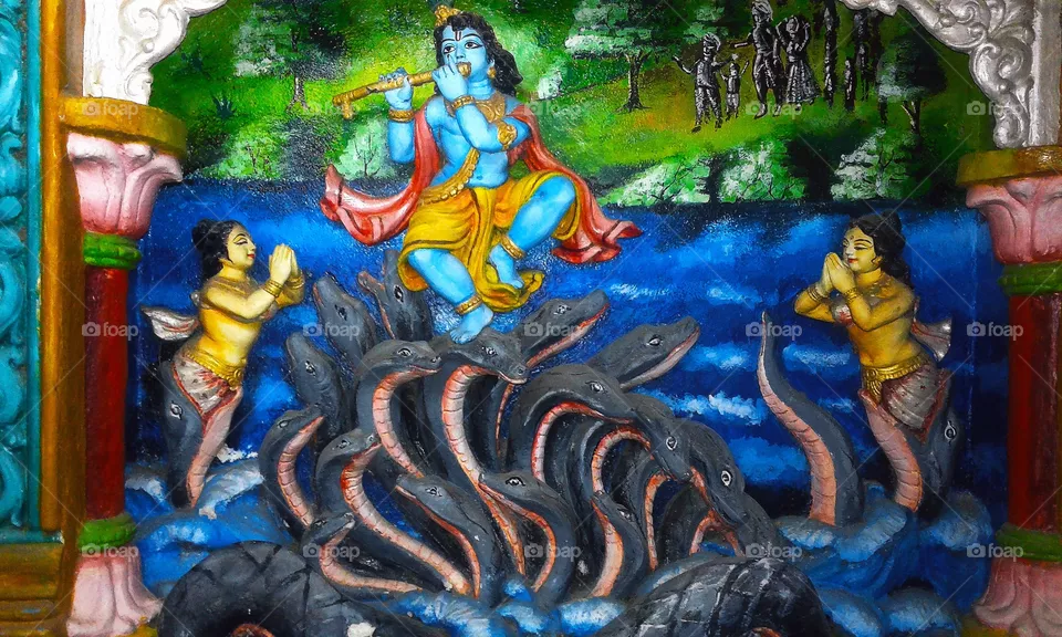 Little Krishna dancing on Kaliya mardans Head