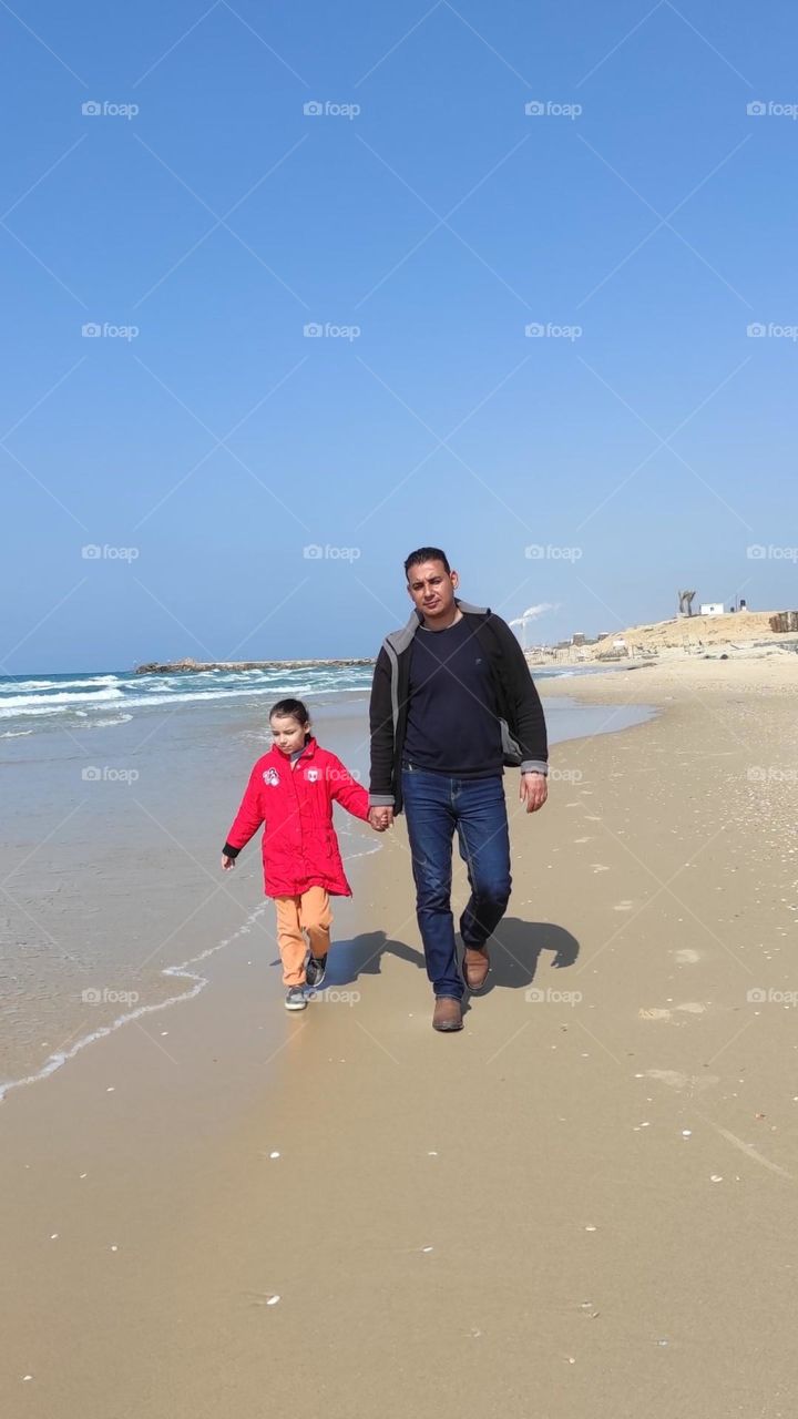 A picture of me and my little girl on the seashore means a lot to me and carries with it the most beautiful meanings of love