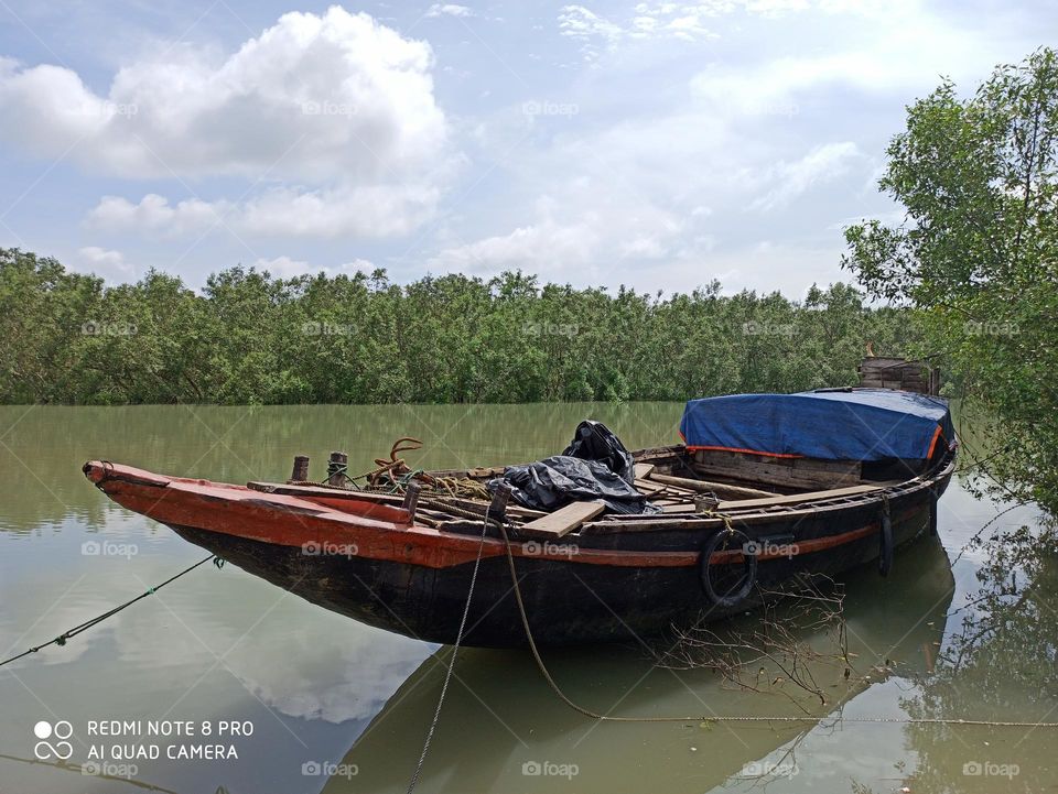 Standing boat on River