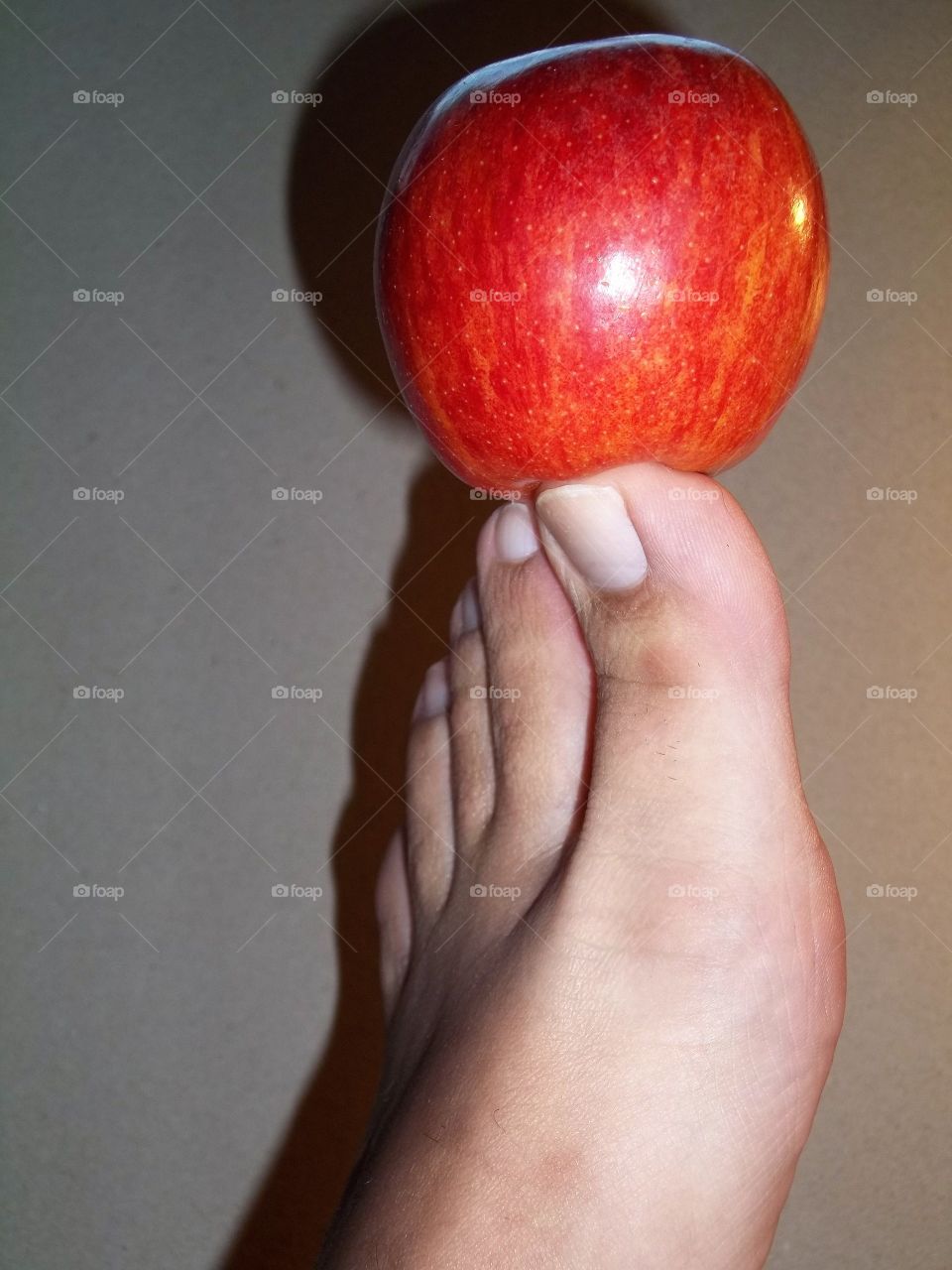Red Apple Balanced on my toes