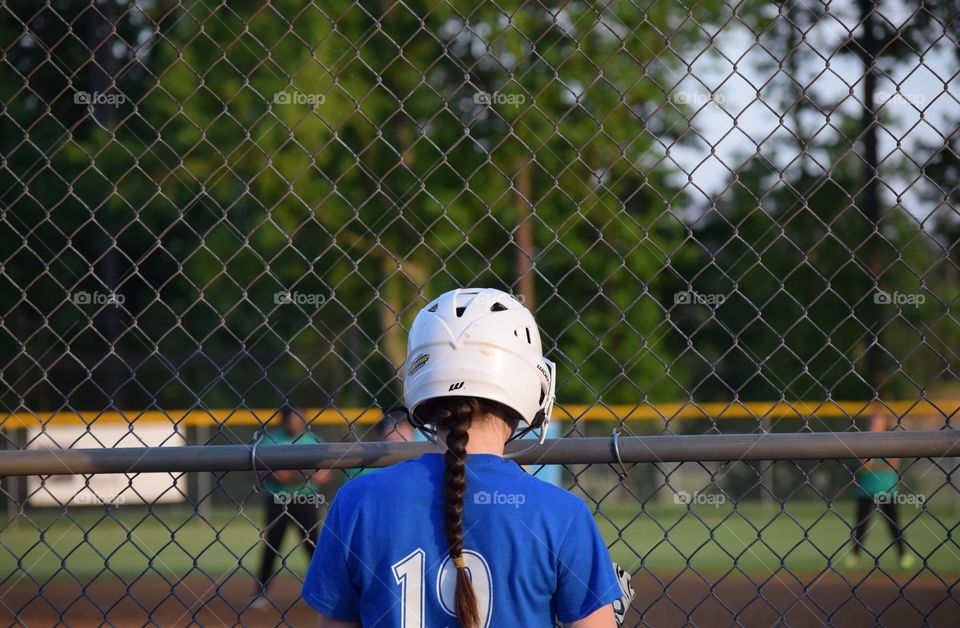 Rear view of a girl wearing helmet