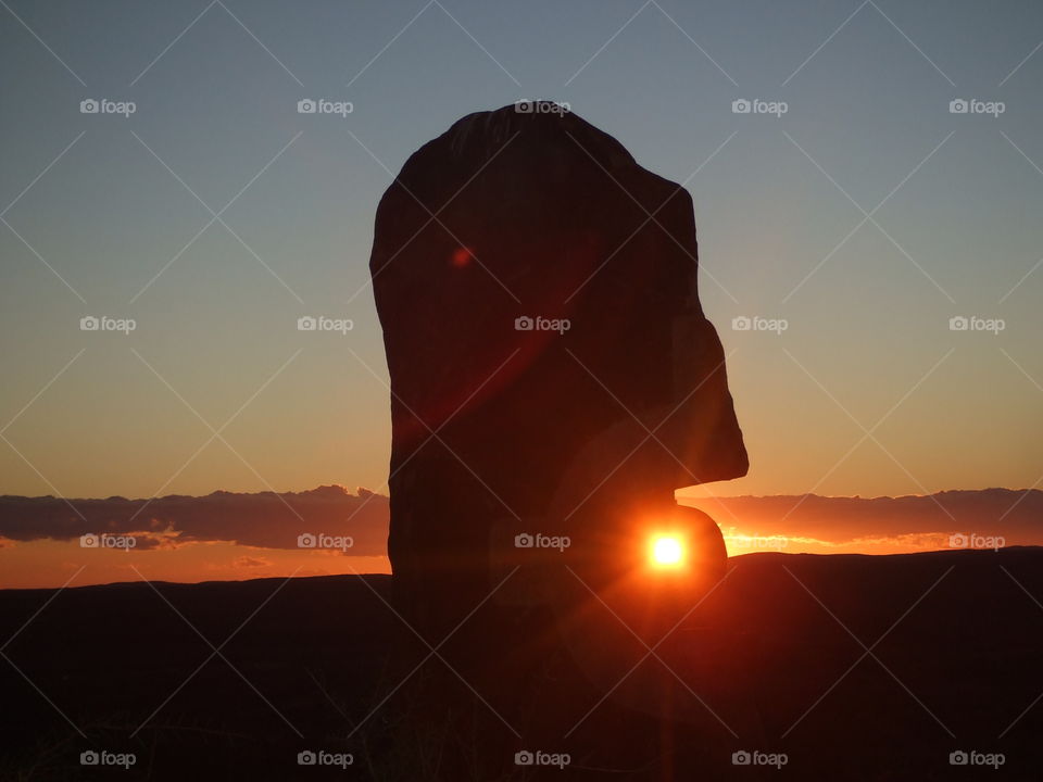 Silhouette of sculpture during sunset
