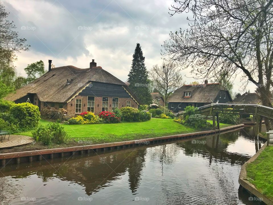 Water canal and houses in Giethoorn, Netherlands 