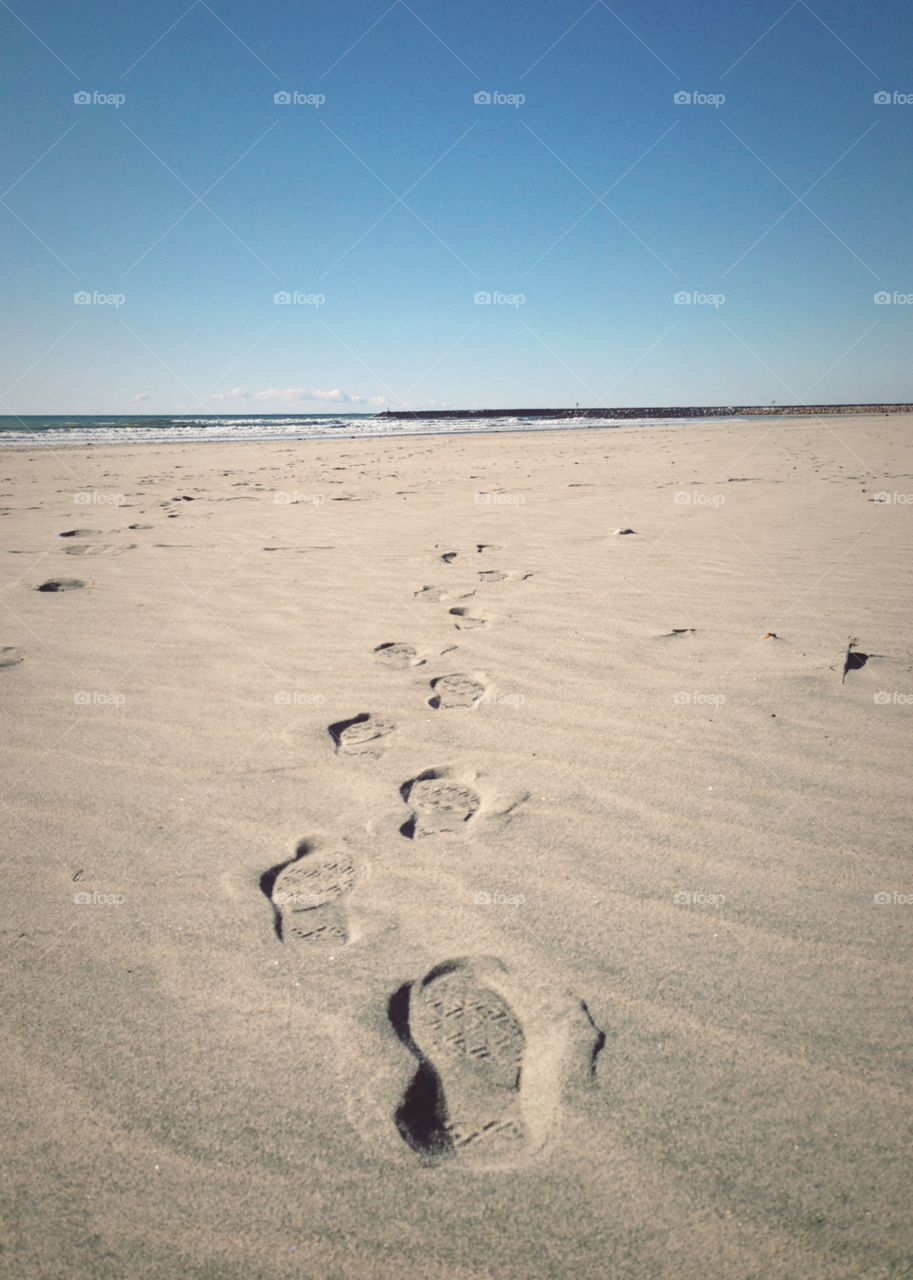 beach water sand footprints by ninjacentral