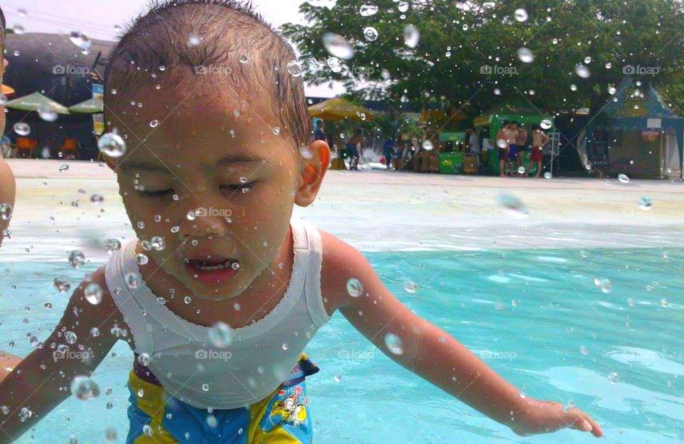 Toddler playing in the pool...