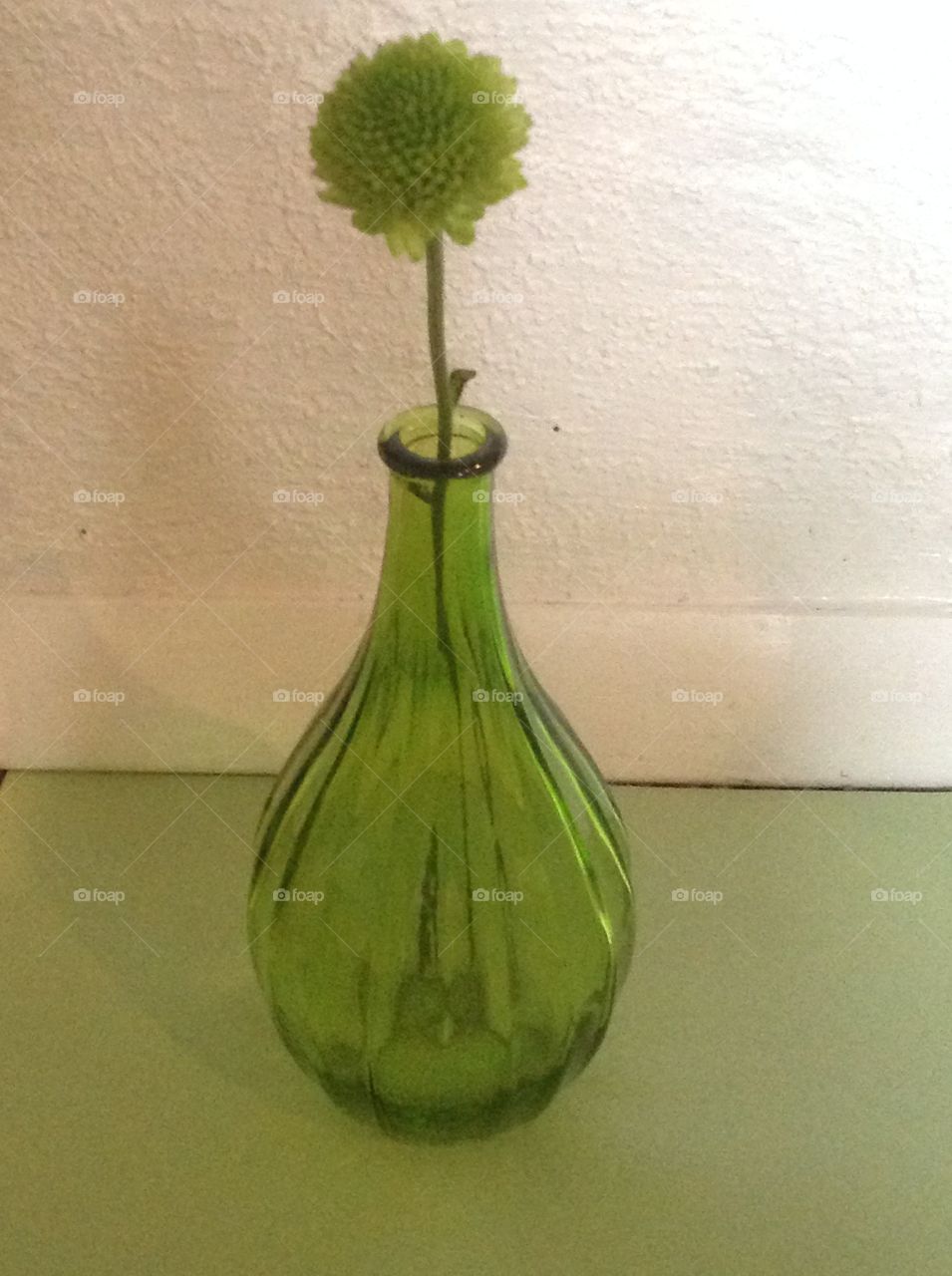 A green glass vase.