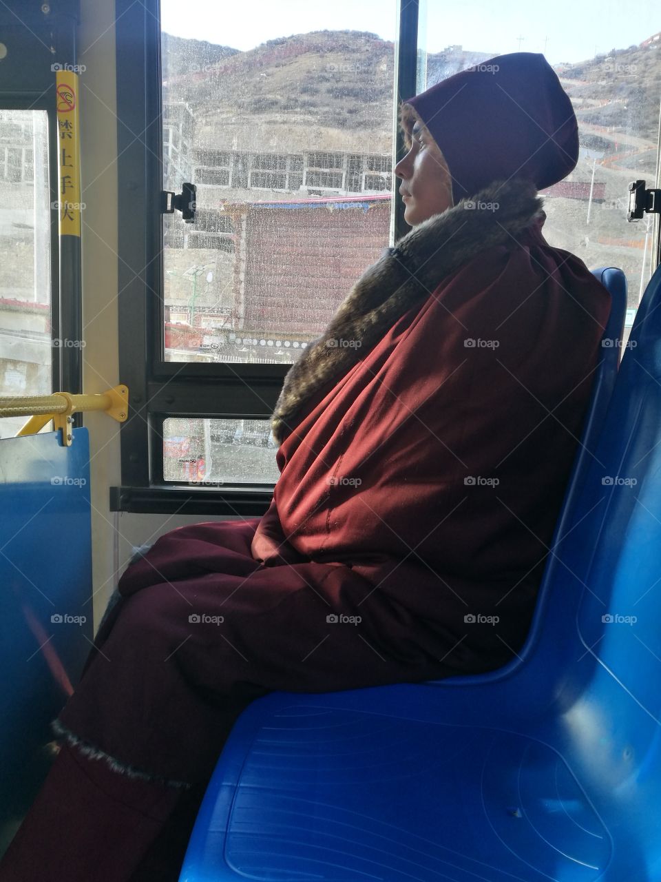 Nun staring into the Valley at Se Da Buddhist Monastery and School in Sichuan Province, China.
Se Da is currently the largest Tibetan Buddhist school in the world and not open to westerners.