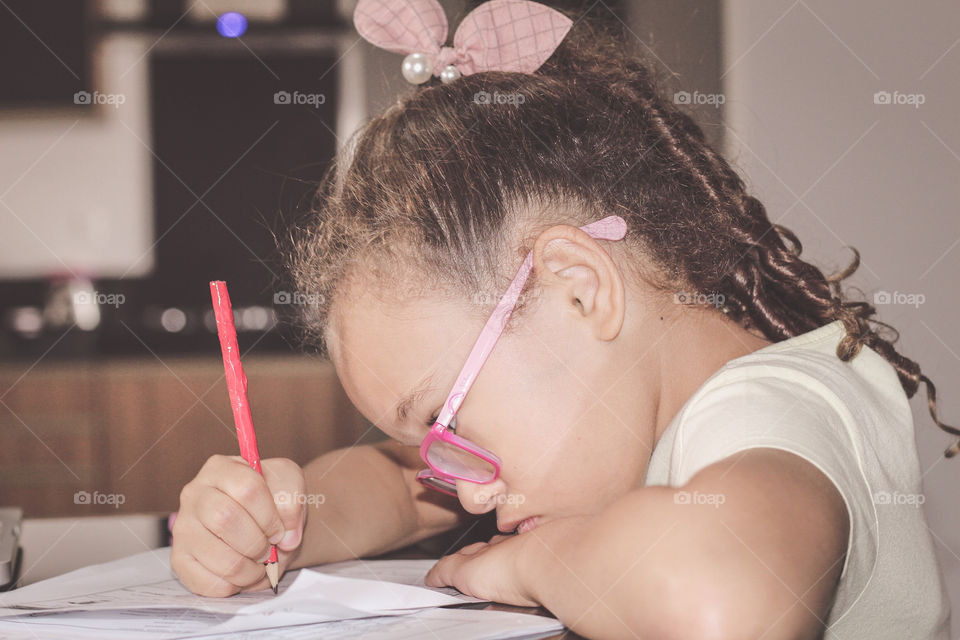 Little girl doing her homework