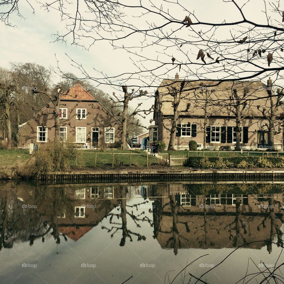 Dutch farmhouse. Dutch farmhouse water mirror image