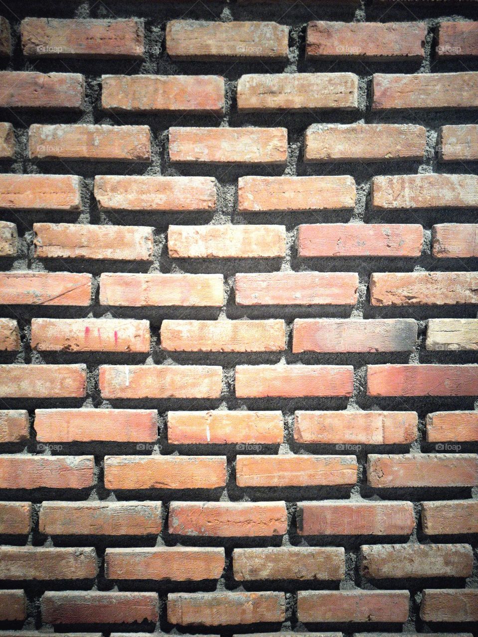 Textured Wall Surface with Orange Bricks