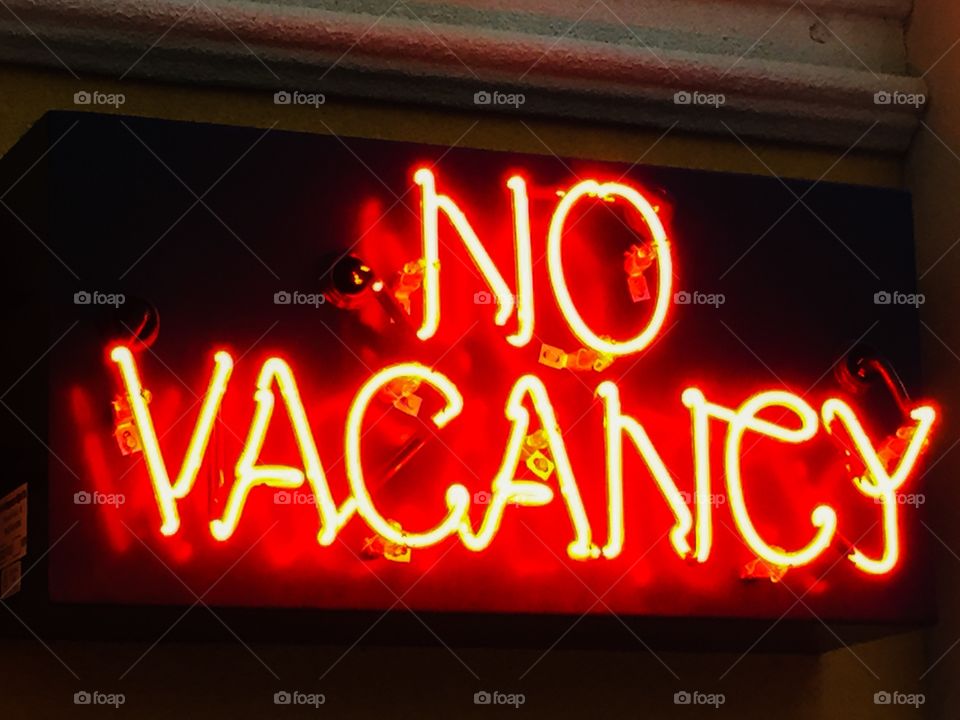 Neon hotels sign. No vacancy at the hotel neon sign.