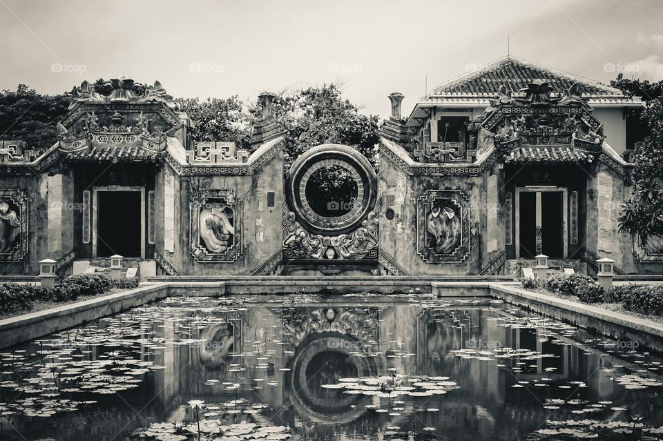 Reflections of the Ba Mu Temple Gate in Hoi An, Vietnam 