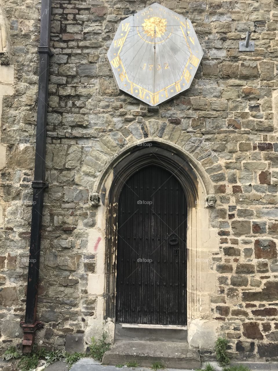 Side door complete with weathervane of Barnstaple Parish Church, in Barnstaple, a very large place of worship, in a central location.