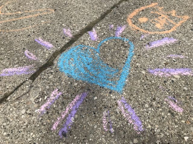 Playing with sidewalk chalk 