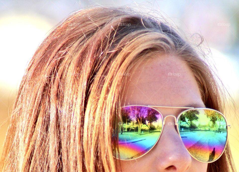 Pop of rainbow color reflected in my sunglasses.