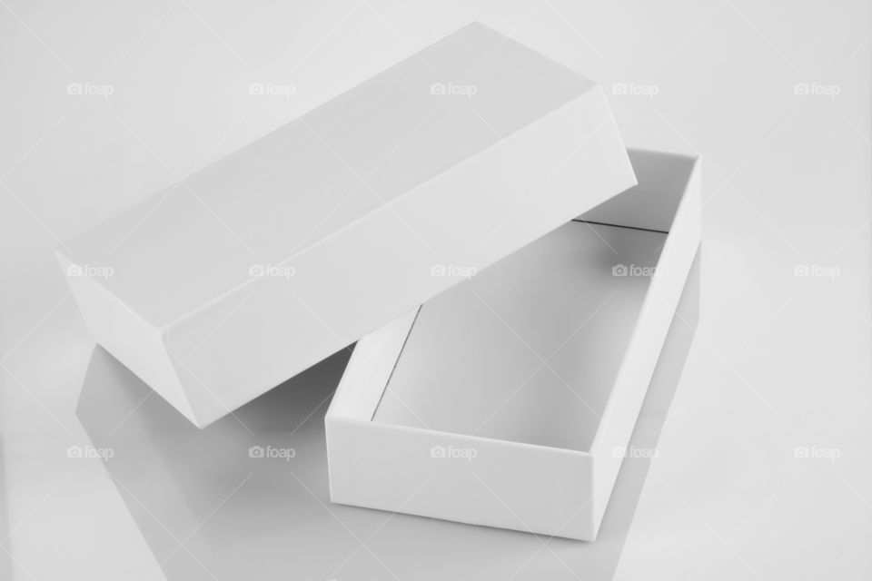 White blank box on white reflective background