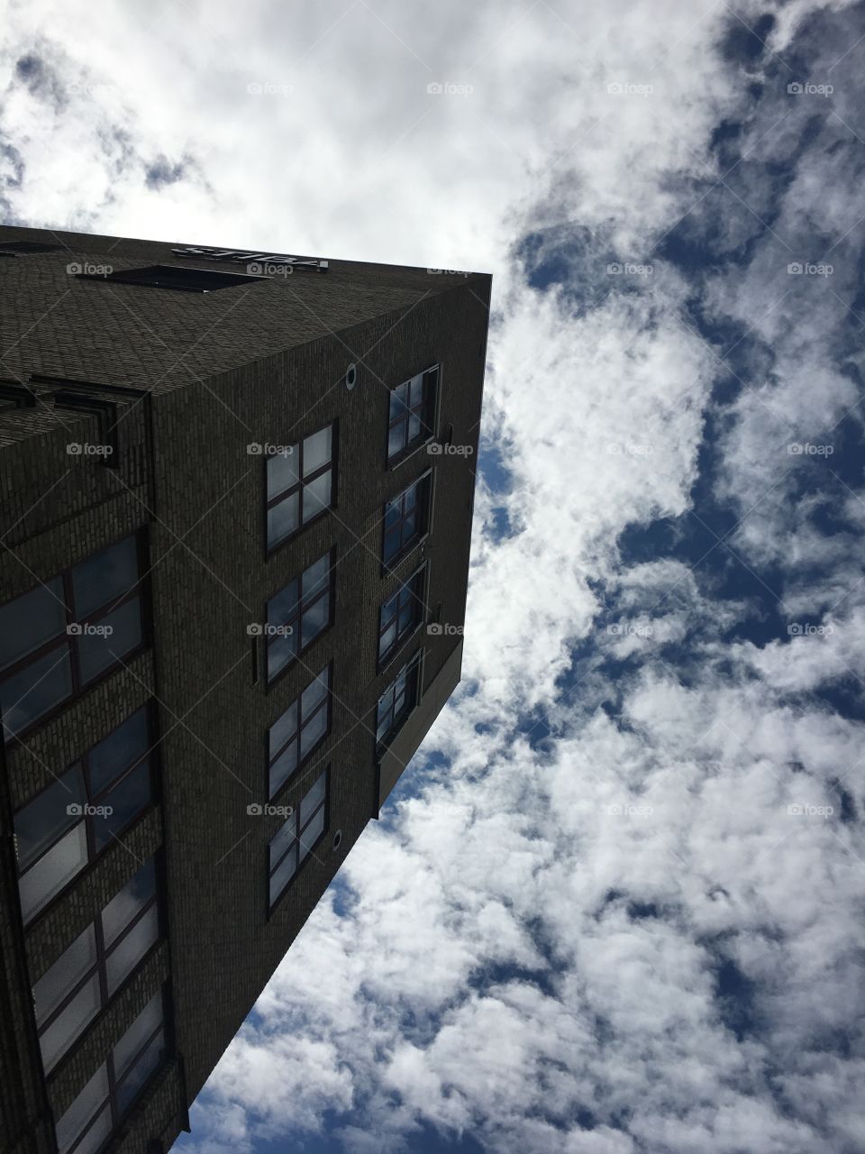 Old buildings from below with clouds