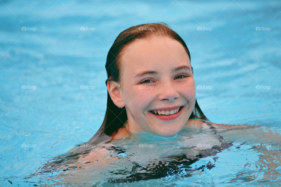 Girl swimming in the pool