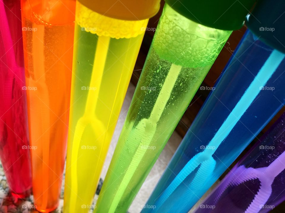 Rainbow colored bubble wands
