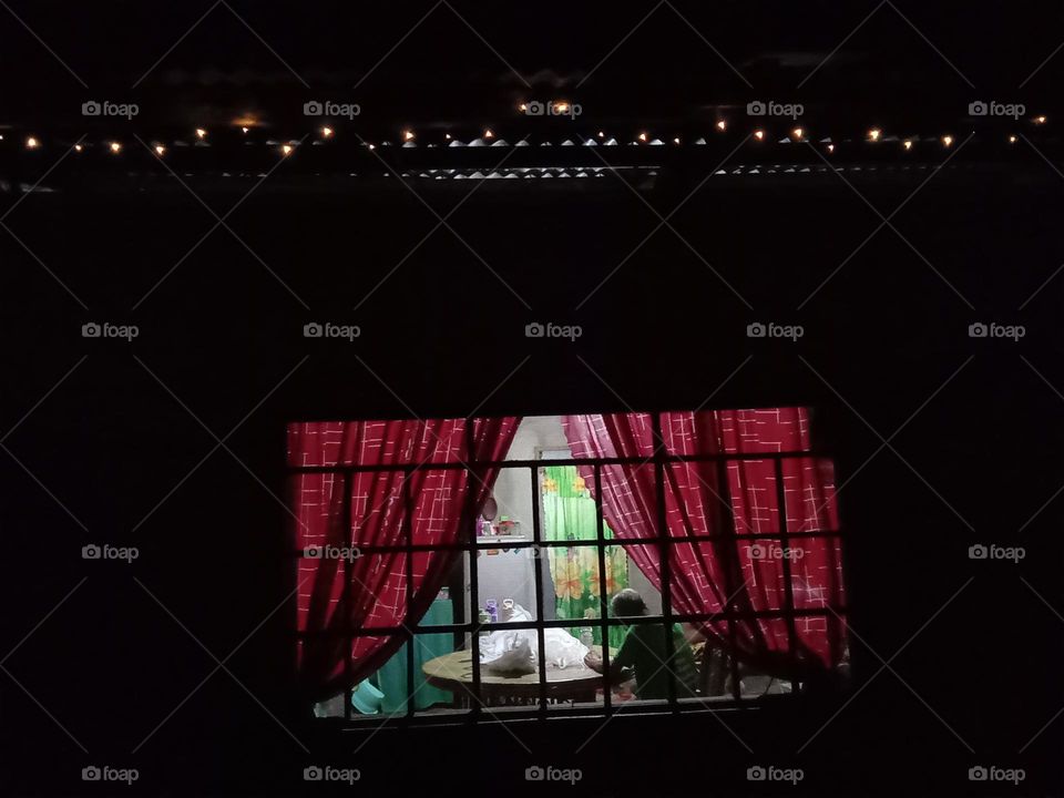 Twinkling windows at farm house 