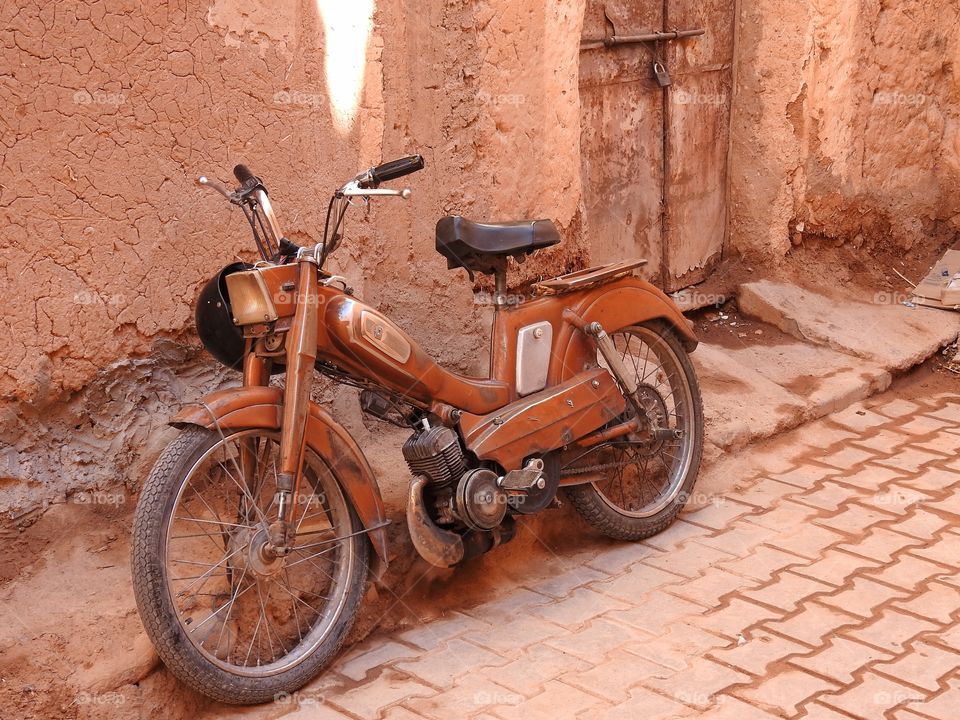 Moped against a wall