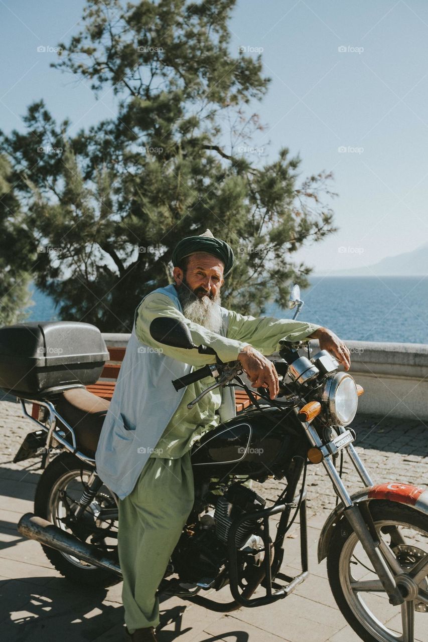 an old man on his motorbike