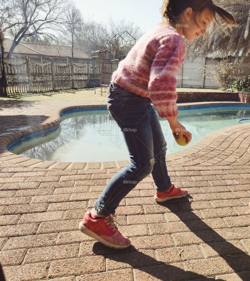 Girl playing with a ball