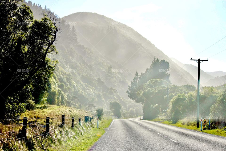 Empty road against the mountain