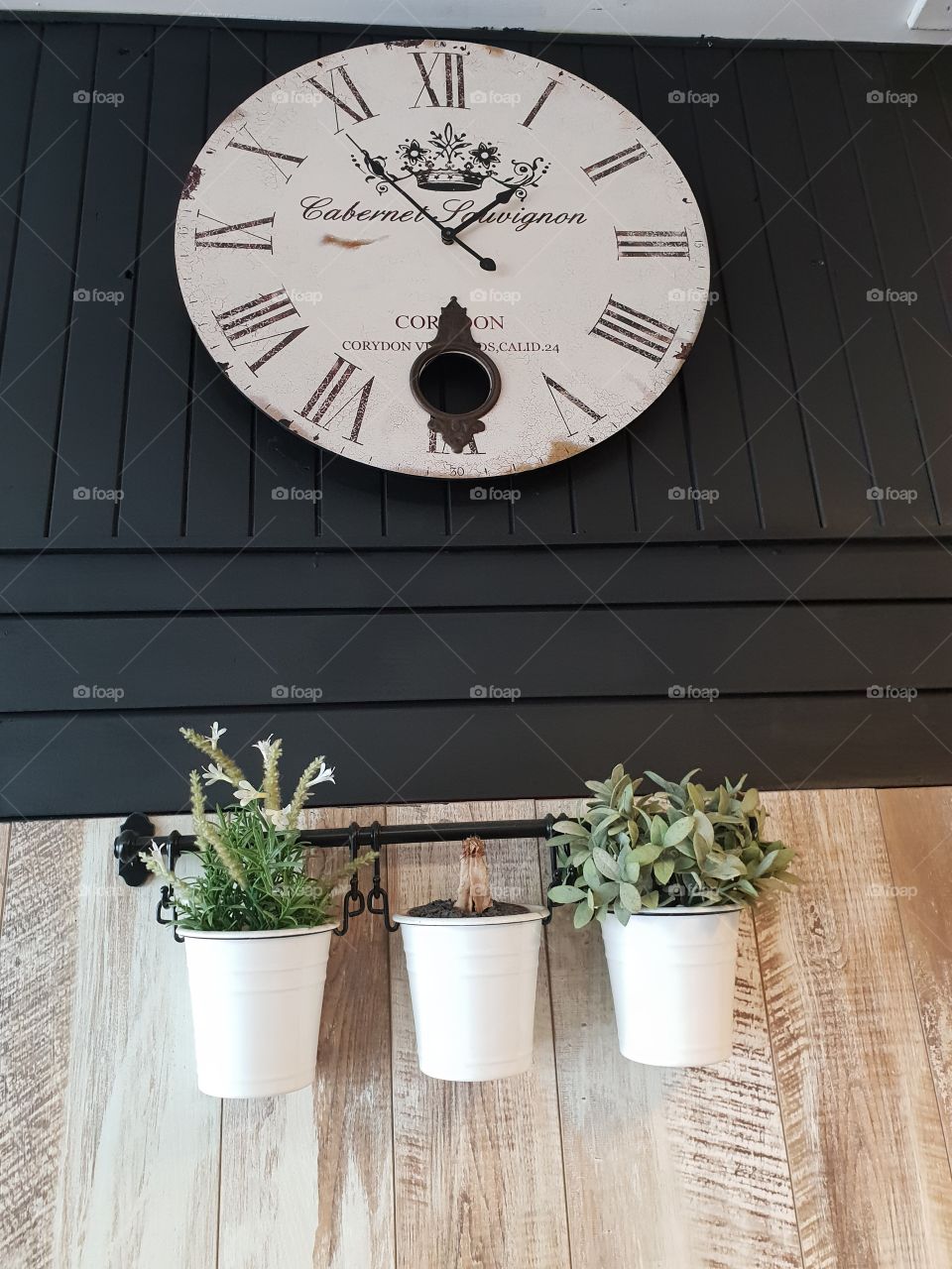Interior clock and flower pot display