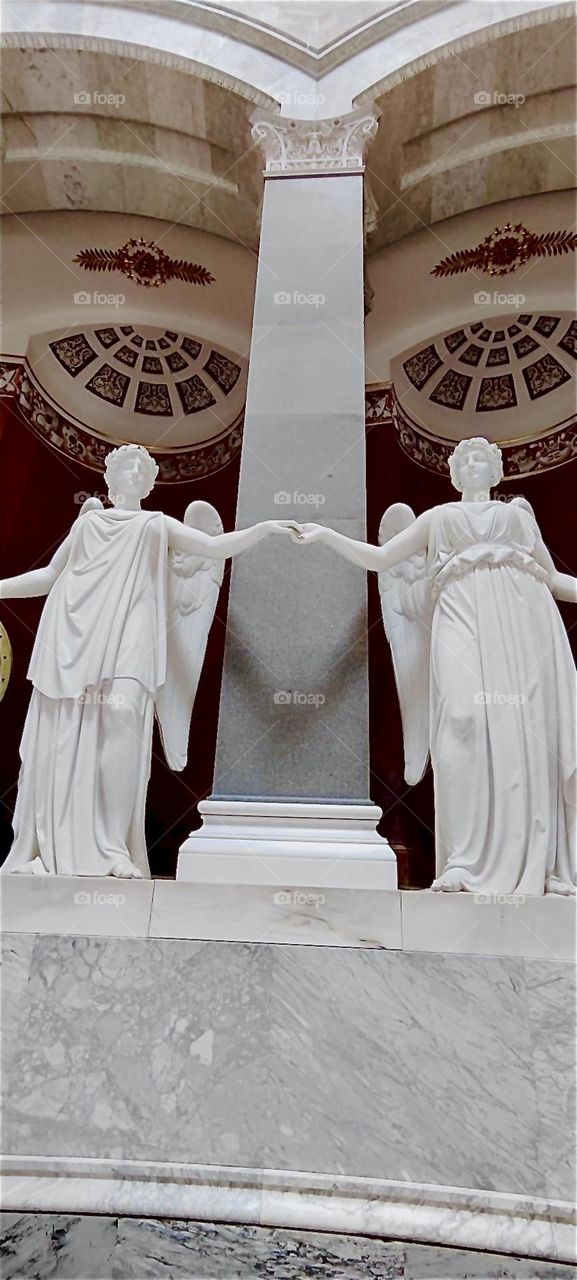 This pair of larger than life winged angels adorns “Liberation Hall” by “Kelheim”, Bavaria built by King “Ludwig I” in 1815 to commemorate the “Liberation Wars” and Germany’s victory over “Napoleon”. 2024. Hypnotic Productions