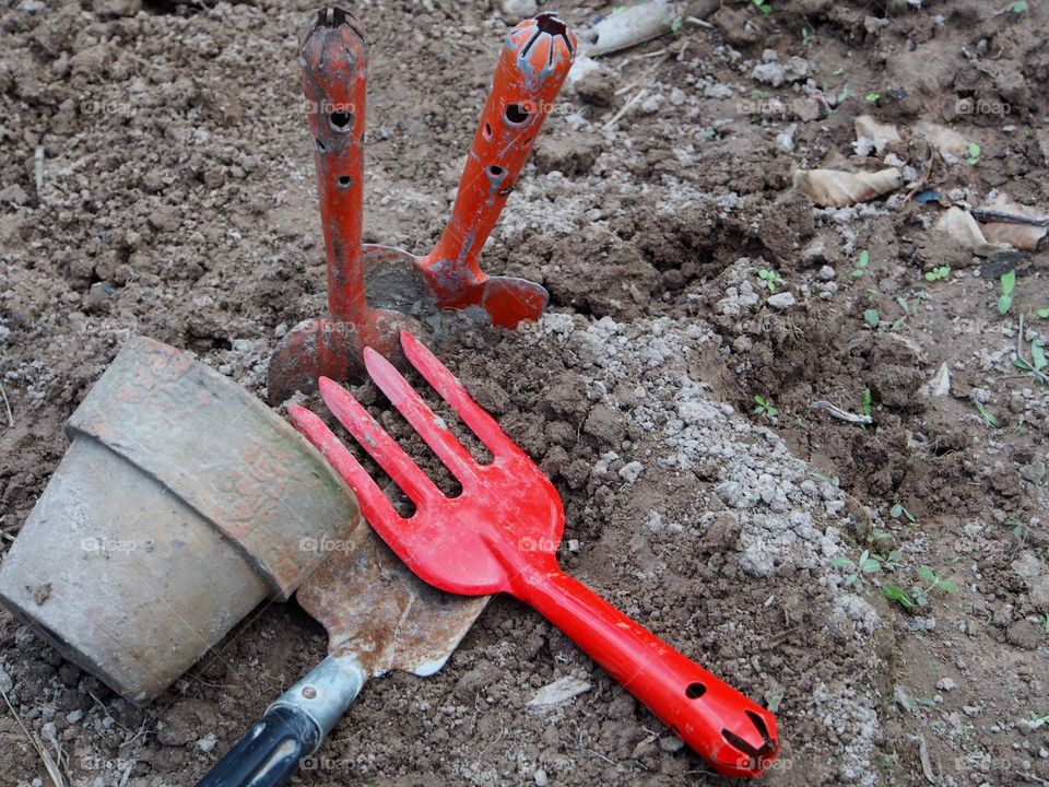 Gardening tools on dirt