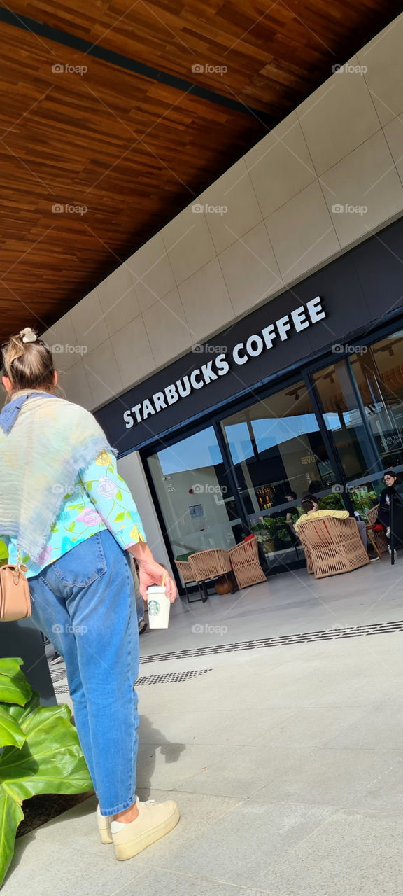 Taking coffee from starbucks