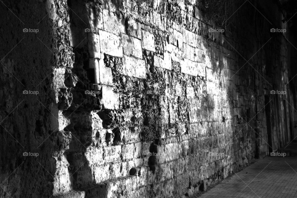 A stone wall marked by time.