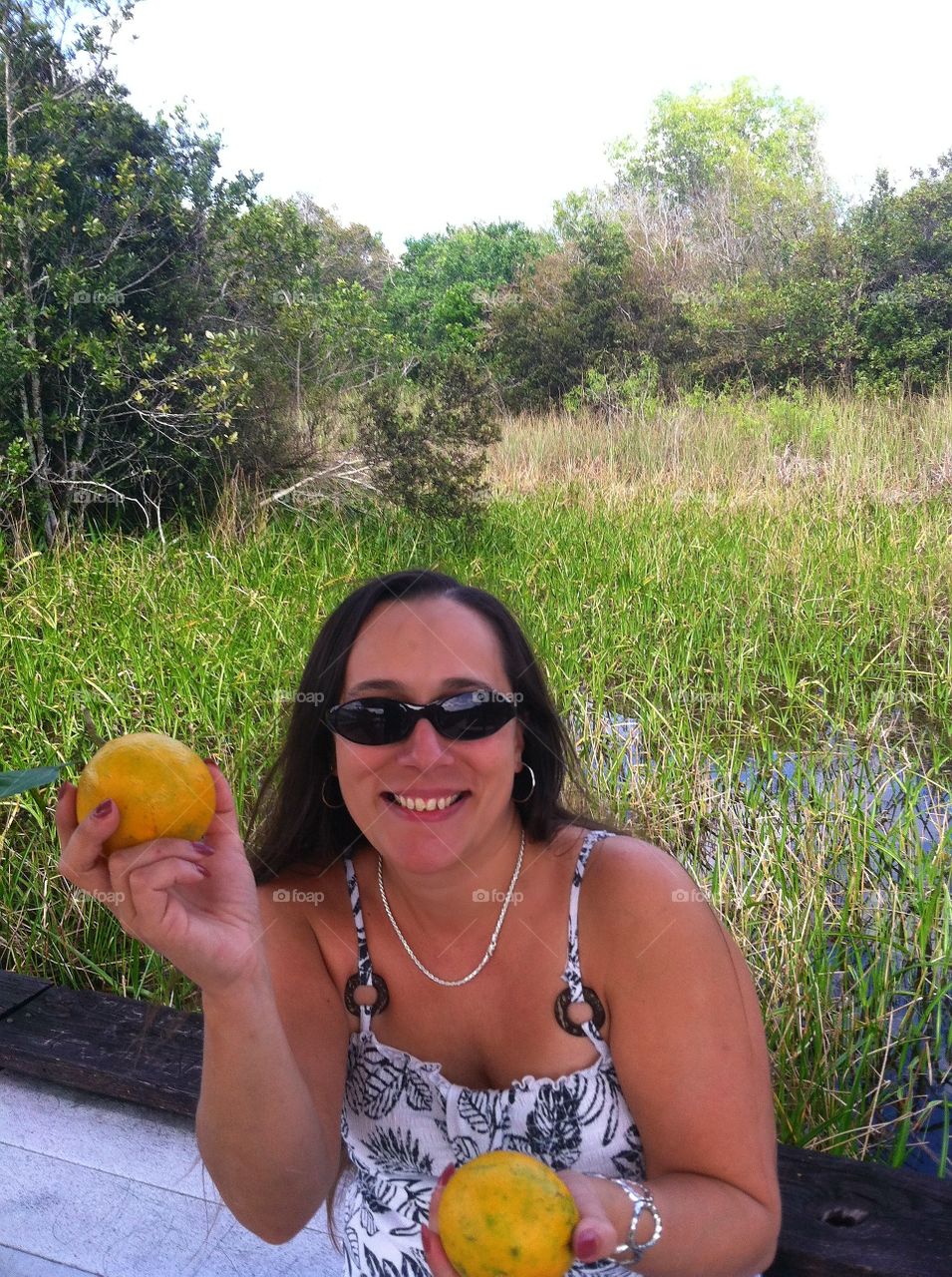 Girl Showing Off Oranges in Florida