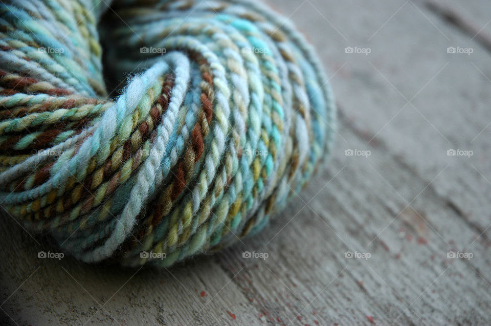 Blue Yarn on wooden table