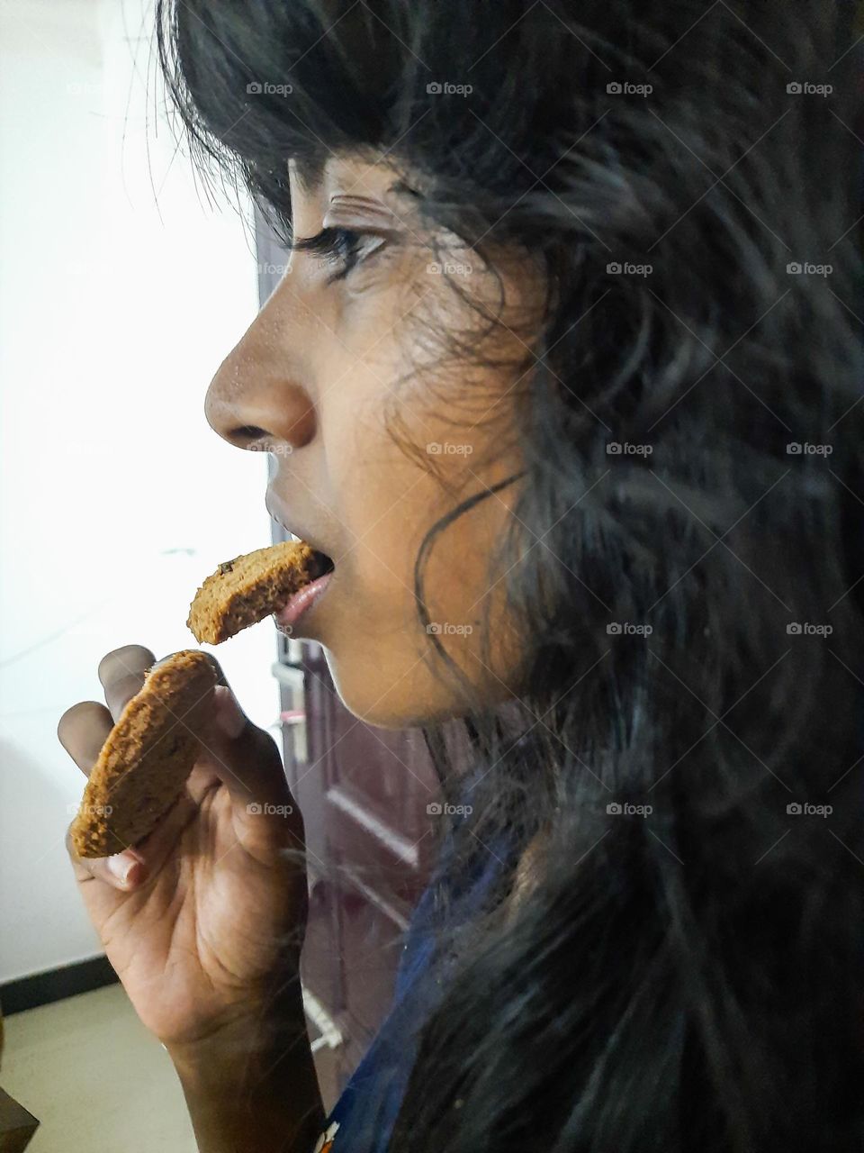 Girl eating  cookies