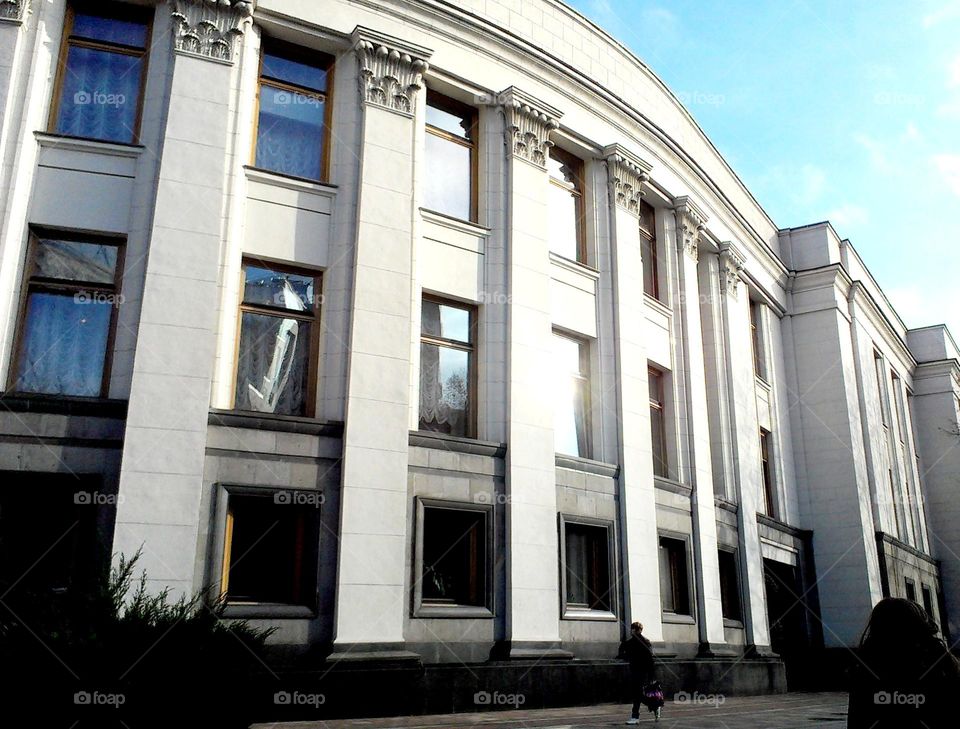 Rectangular windows of the building on the background of the sky