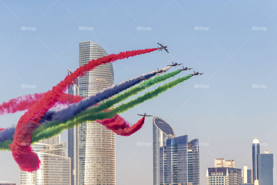 Al Fursan aerobatic team flying over Abu Dhabi Corniche