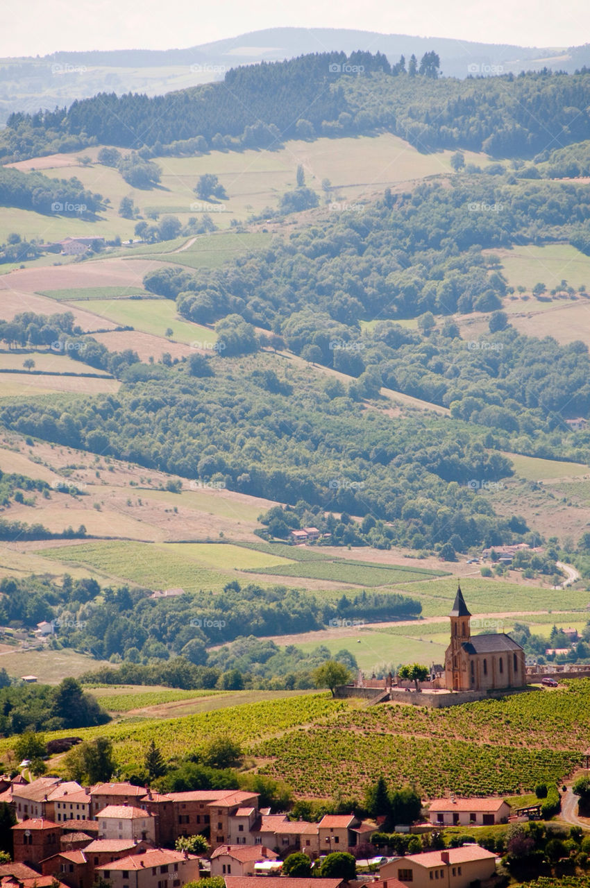 The cathedral sits among the hills and farms of southern France