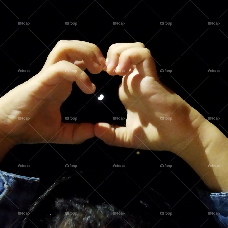 Beautiful moon between human hand