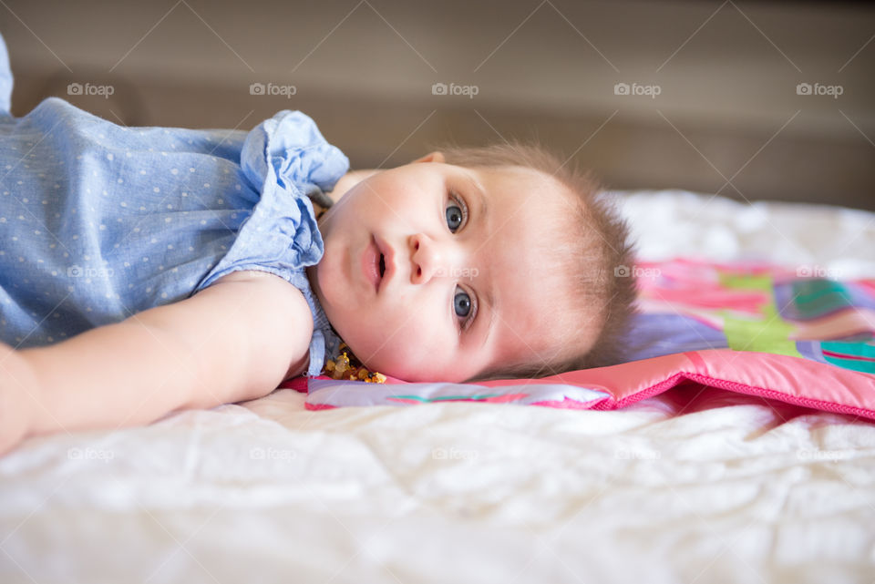 Cute baby girl looking at camera