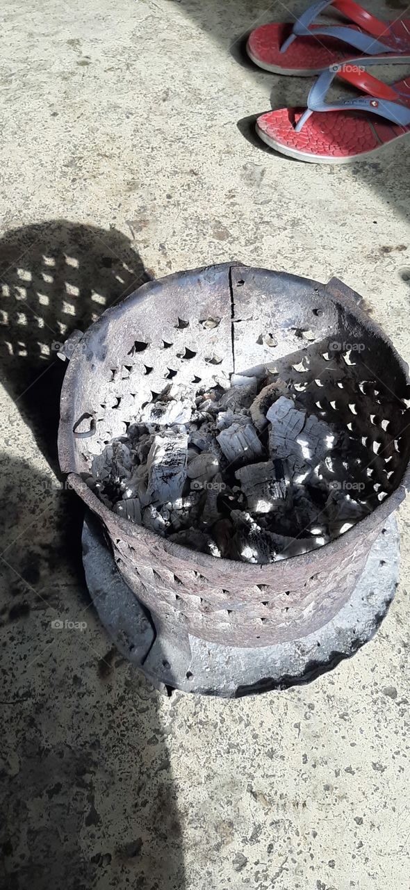 charcoal pot burning and still hot...local made