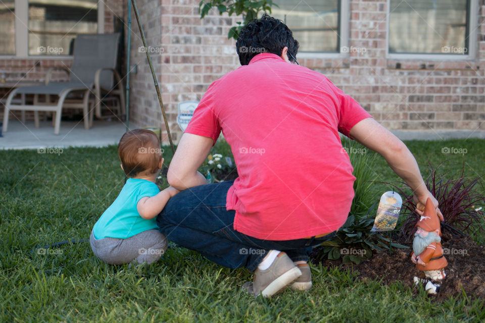 Daddy and son in the garden 