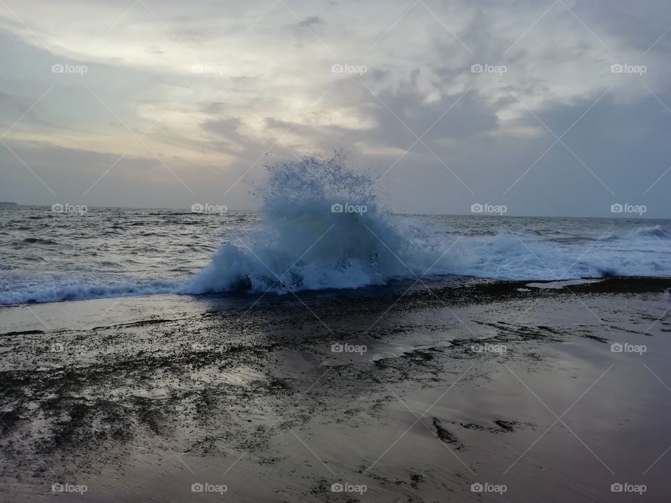 Sea water splashing on a evening