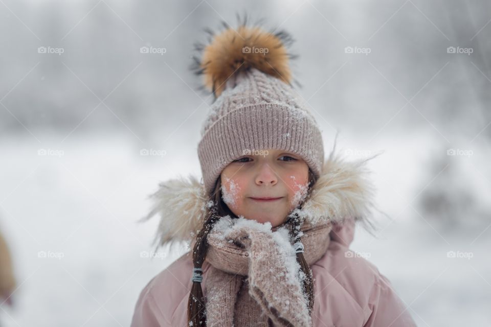 Little girl in a winter park