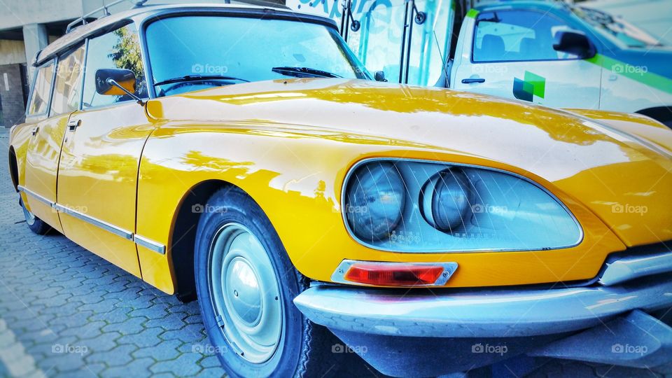 The Citroën DS is a front-engine, front-wheel-drive executive car made in France. It's design resembles that of a platypus and has a cult following. This yellow specimen is a rare station wagon variant.