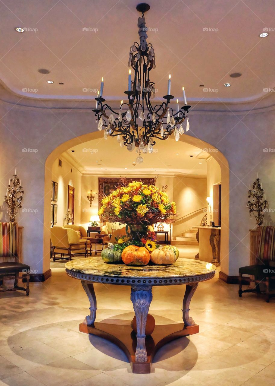 A grand foyer entrance decorated for Fall, Halloween and Thanksgiving.