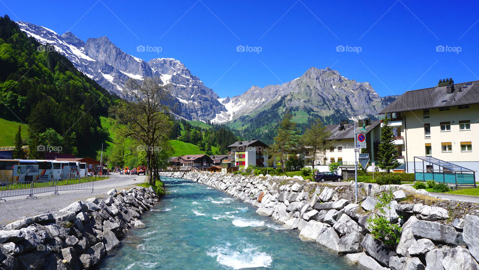 View of snowy mountains and river in Swiss