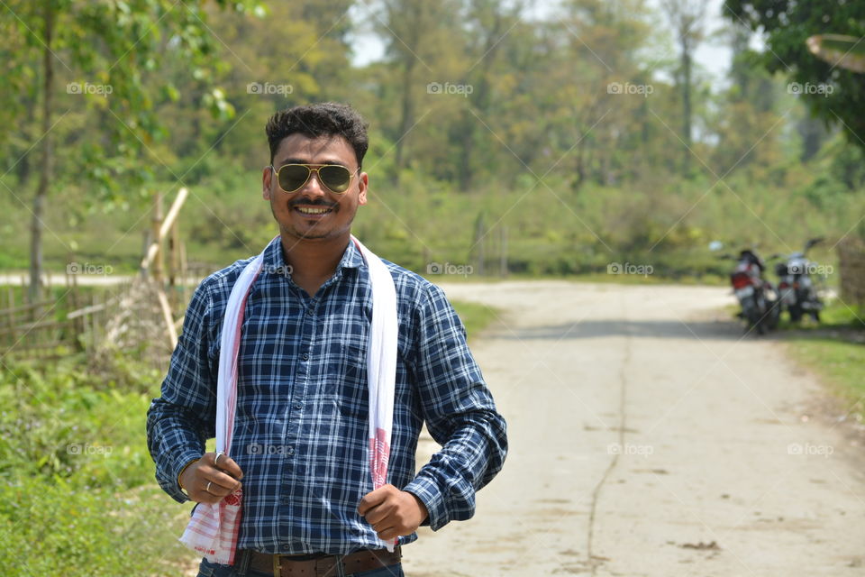 Dev in Assam with a cute smile in beautiful Nature